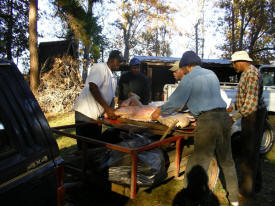 The Roasting Team Preparing the Pig