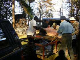 The Roasting Team Preparing the Pig